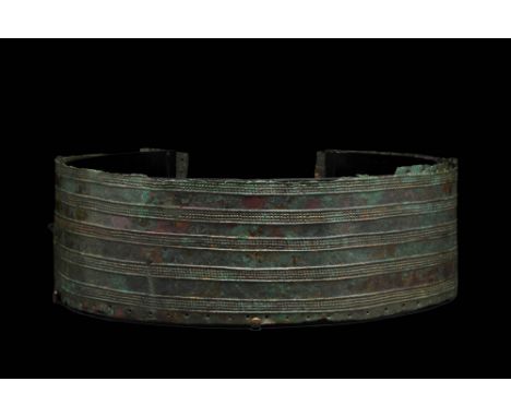 Ca. 1200 - 1000 BC An incredibly rare complete Urartian belt. This example is made from hammered bronze and decorated in low 