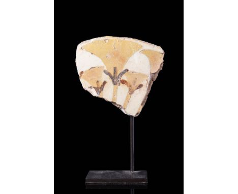 Ca. 1550 - 1292 BC A glazed faience inlay tile with four pale yellow papyrus flowers, with the lower part of the flower paint
