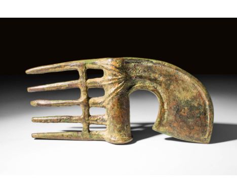 Ca. 1200 - 1000 BC A cast bronze spike-butted Western Asiatic axe head, featuring a cylindrical shaft hole decorated with fur