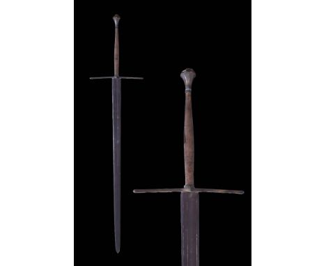Ca. Late 16th century AD or earlier A colossal two-handed sword with a straight, double-edged blade and a wide, shallow fulle