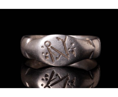 Ca. AD 400 - 700 An elegant Merovingian bronze ring featuring a round hoop with a flat section connected to the bezel, which 