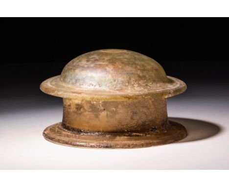Ca. 200 - 50 BC A Hellenistic mould-blown pale yellow glass pyxis with a cylindrical form. The vessel has a slightly concave 