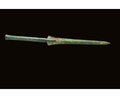 Ca. 1000 - 500 BC A Greek Aegean or Western Asiatic long bronze spearhead with a double-edged leaf-shaped blade. It has a mid