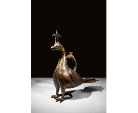 Ca. AD 1100 - 1300 An Islamic Khorasan copper alloy ewer in the shape of a bird, probably an eagle, with a rudimentary rendit