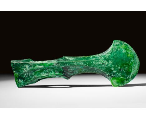 Ca. 1200 - 700 BC A bronze axe-head from the Koban culture. It has a hammer on the left side, and an axe head on the right si