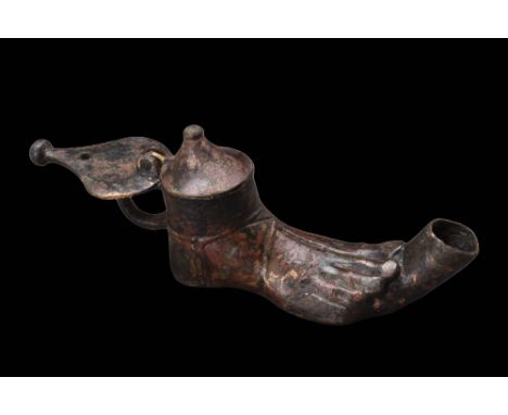 Ca. AD 100 - 200 A beautiful cast-bronze oil lamp in the shape of a human foot. The lamp has two openings, one from which a w