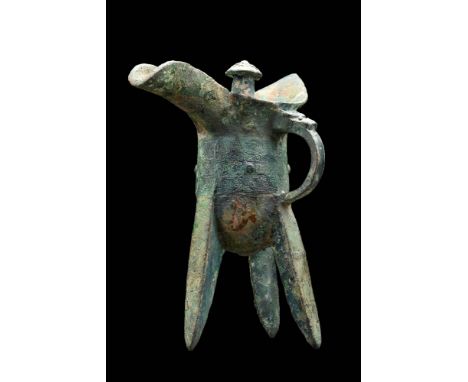 Late Shang Dynasty, Ca. 11th Century BC An ancient Chinese Jue used to ceremoniously heat and pour wine. This vessel has an o