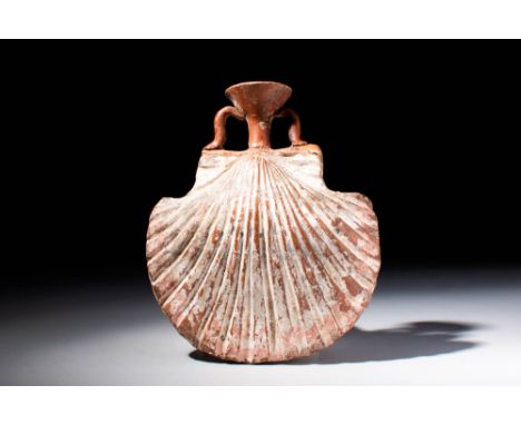 Ca. 400 - 200 BC A Greek terracotta flask composed of a highly detailed double-valve shell-shaped body with deep vertical gro