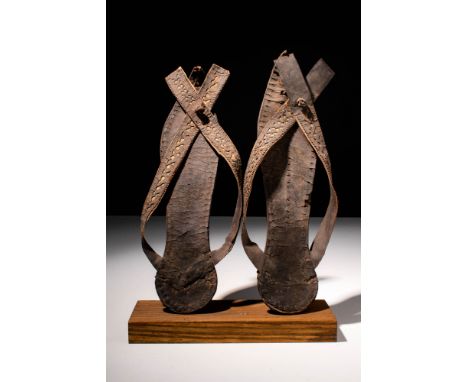 Ca. AD 300 - 700 An Egyptian-Coptic pair of leather sandals with a tang emerging between the big and second toes and two stra
