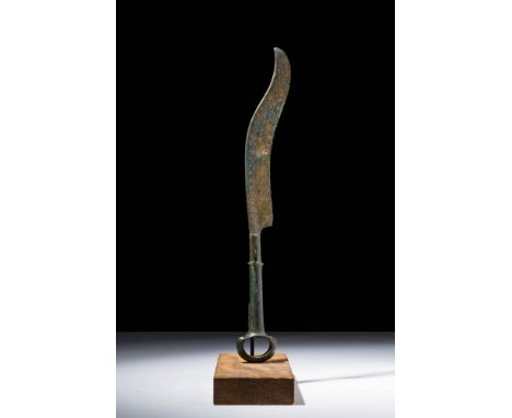 Ca. 1200 - 700 BC An Iron Age bronze rare Type of knife inspired by the shape of a sickle. The shape of the knife is slightly