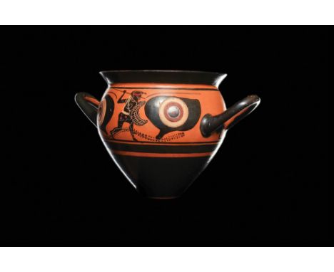 Magna Graecia, Archaic Period, Ca. 520 BC A fine black figure cup with a flared rim, opposing loop handles and a bulbous tape