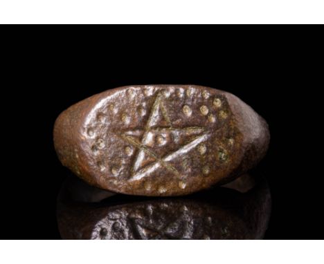 Ca. AD 300 - 600 A late Roman or early Byzantine bronze ring. The ring has a round hoop that smoothly transitions into a flat