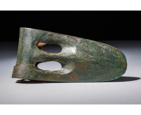 Ca. 2055 - 1790 BC An Egyptian Middle Kingdom bronze axe. It has a duckbill-shape with a socket to attach a handle and two pa
