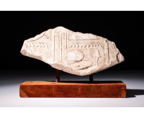 Ca. 2680 - 2160 BC A Relief carved limestone fragment with raised hieroglyphic elements. Overall excellent ancient surface pa
