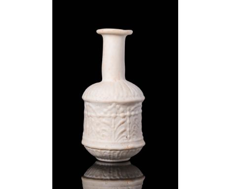 Ca. AD 1 - 100 A stunning Roman Sidonian glass bottle with a vertical and narrow neck connected to a rim with a sloping edge.
