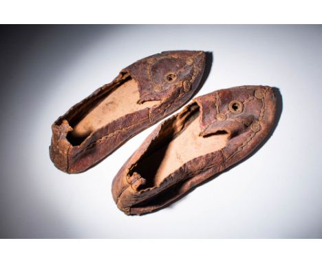 Ca. AD 400 - 700 An Egyptian coptic pair of leather shoes, with high walls and geometric inlad spierals. Leather footwear was