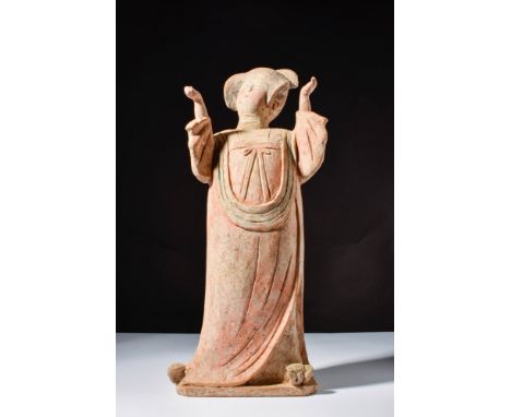 Ca. AD 618 – 907 A beautiful painted Chinese terracotta fat lady. She is depicted in a rare posture with her hands held up, a