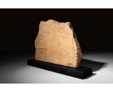 Ca. AD 100 - 300 A Roman terracotta fragment of brick, polygonal in form, with a rectangular inscribed stamp, probably a symb