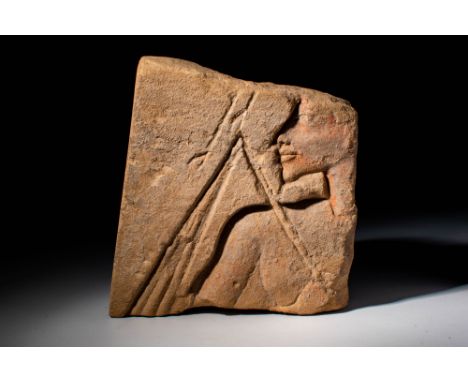 New Kingdom, 18th Dynasty, Ca. 1346 - 1330 BC An Egyptian sandstone relief showing King Akhenaten's figure facing left. The f