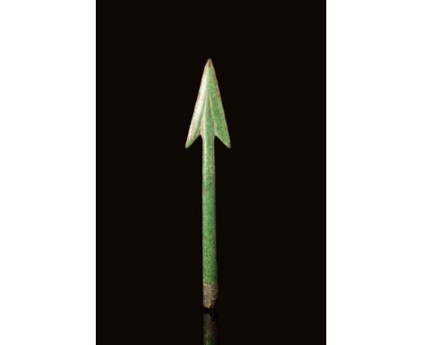 Ca. 500 - 100 BC A Celtic bronze arrowhead with a long cone to house a wooden shaft. The point is composed of two very elonga