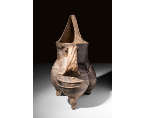 Ca. 3000 - 1900 BC A Chinese Longshan culture pottery Gui. The tripod legs are in large sack forms, each individually moulded