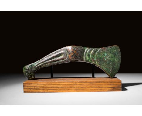 Ca. 2500 - 2000 BC A Bactrian bronze votive axe that would have been placed atop a standard for ceremonial purposes. It has a