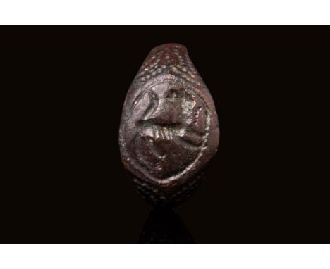 Ca. AD 200 - 400 A late Roman bronze ring with a circular bezel depicting a lion framed within a circular line. The shoulders