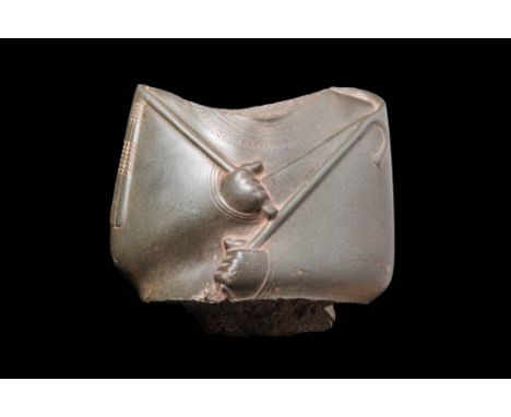 Later Period, 26th to 30th Dynasty, Ca. 664 - 343 BC An Egyptian torso fragment in green greywacke stone depicting the revere