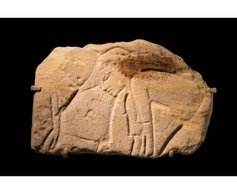 New Kingdom, 18th to 20th Dynasty, Ca. 1550 - 1069 BC An Egyptian sandstone relief showing a worker. The features are well-de
