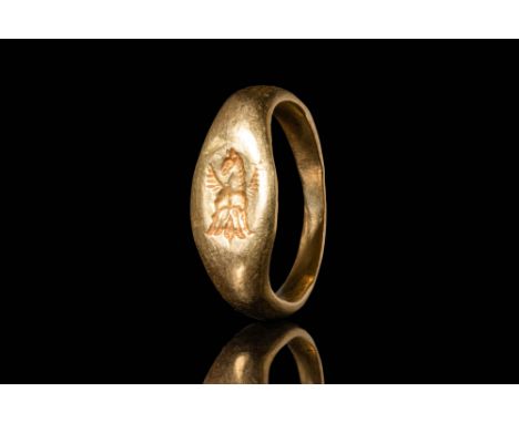 Ca. 500 - 400 BC A Greek gold ring with an elongated bezel depicting a front-facing Pegasus with a raised head and spread win