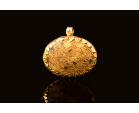 Ca. 300 - 100 BC A Hellenistic gold pendant with encased millefiori glass bead with a circular gold-coloured motif. A series 