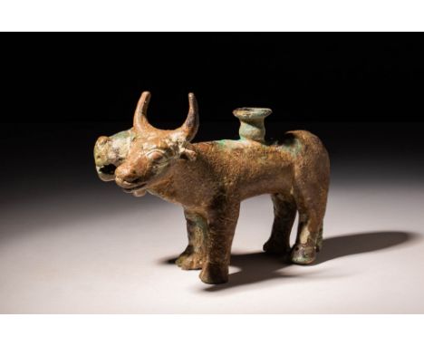 Ca. 1500 - 1000 BC A very rare Near Eastern cast-bronze stand in the shape of a composite Lion and Bull. The animal with two 