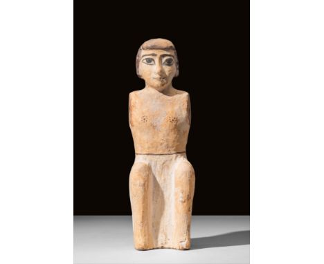 Middle Kingdom, 11th to 13th Dynasty, Ca. 2345 - 2181 BC A rare Egyptian boatman funerary figure carved from a single piece o