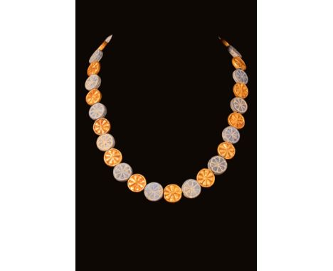 Ca. 1550 - 1069 BC A wonderful Egyptian necklace comprised of dozens of faience and gold beads in the shape of rosettes. All 