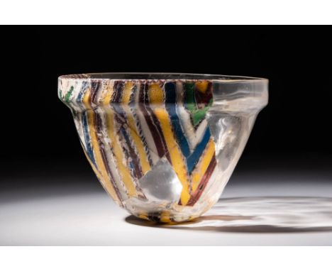 Ca. AD 100 - 300 A stunning Roman striped mosaic glass bowl of a traditional form from the period. This vase presents a mesme