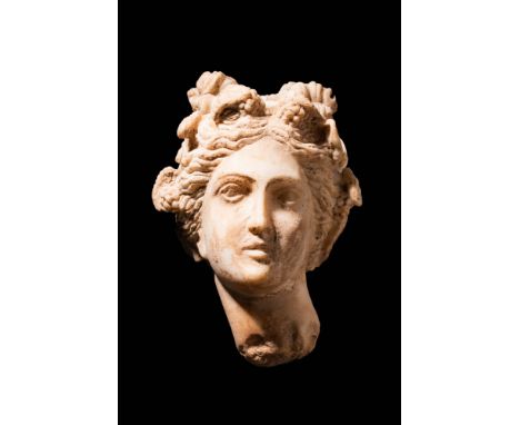 Ca. AD 100 - 200 A wonderful marble portrait of the Roman god Dionysus, stylistically inspired by Hellenistic sculptures. He 
