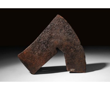Ca. AD 800 - 1000 A forged iron axe head of a hefty form with a conical socket, a short neck, and a vertically oriented blade