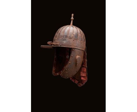 Ca. AD 1600 - 1700 An Ottoman zischägge composed of a brim, cheek protection, and rear ‘lobster-tail’ neck protector riveted 