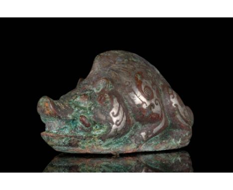 Ca. 475 - 221 BC A bronze figure of a boar inlaid with a red stone, possibly red-agate. The figure is highly stylised and has