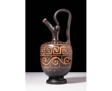 Ca. 400 - 300 BC A large Apulian Xenon group oinochoe with an elegant body and a ringed foot, characterised by its distinct p