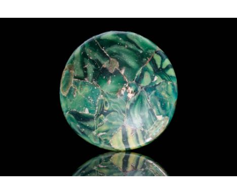 Ca. AD 100 - 300 A Roman glass bowl of a shallow, hemispherical form composed in the mosaic (or millefiori) technique with ca