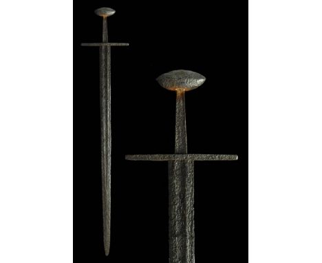 Ca. AD 950 - 1300 A medieval forged iron sword with a distinctive Brazil nut pommel and straight, square crossguard. In Ewert