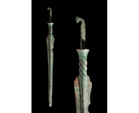 Ca. 1000 - 800 BC A Western Asiatic bronze spear. The spear had a petaloid blade which connects to a twisted section at the b