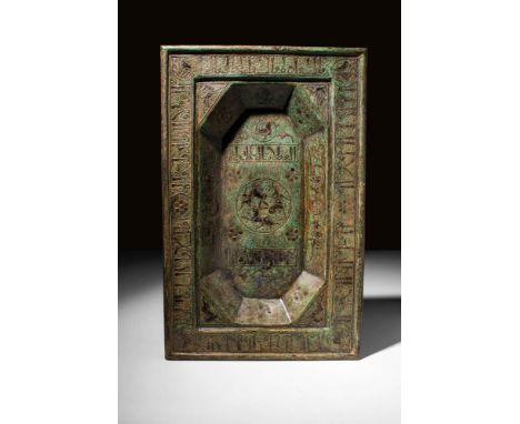 Ca. AD 1000 - 1200 An Islamic Seljuk tray hammered from a thin sheet of bronze, formed into a rectangular form with a shallow