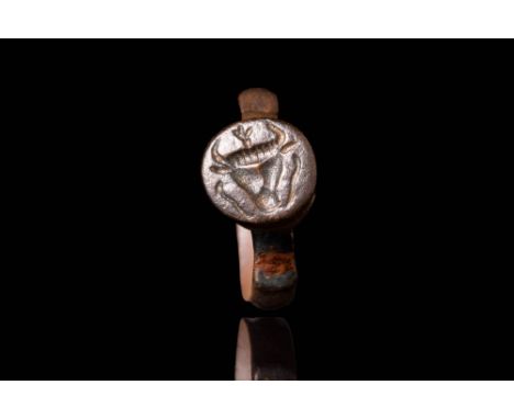 Ca. AD 200 - 400 A late Roman ring crafted from bronze. The ring has a round hoop with tubular section connected to a circula