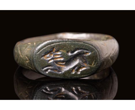 Ca. AD 200 - 400 A Roman bronze ring featuring a D-shaped section hoop decorated with a geometric motif connected with an elo