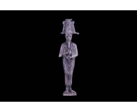 Late Period, 26th Dynasty, Ca. 664-525 BC A silver votive figurine of Osiris wearing an atef crown, plumed on each side with 