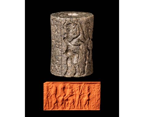 Ca. 2350 - 2150 BC or later An Akkad III cylinder seal depicting a battle scene with a curly haired hero. Surrounding this, t