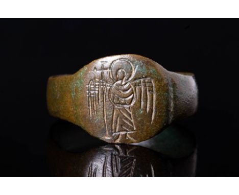 Ca. AD 300 - 700 A Byzantine ring crafted from bronze. The ring has a round hoop that smoothly transitions into a flat sectio