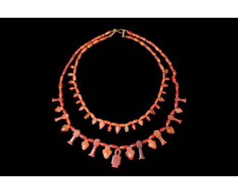 Ca. 1550 - 1070 BC A beautiful set of two wearable Egyptian necklaces featuring ancient carnelian beads, each one meticulousl